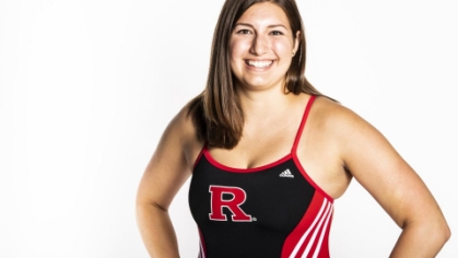 headshot of female swimmer wearing block R black and red swimsuit