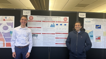 Undergraduate Nicholas Percarpio and Professsor Azziz Ezzat flanking research poster. 