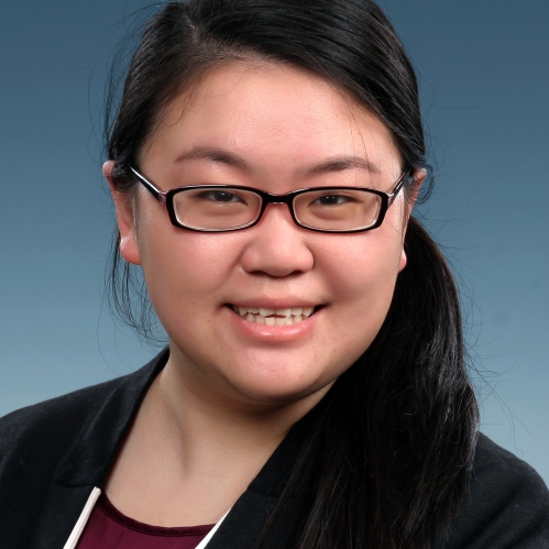 Headshot of an Asian female with eyeglasses, black hair pulled into a ponytail